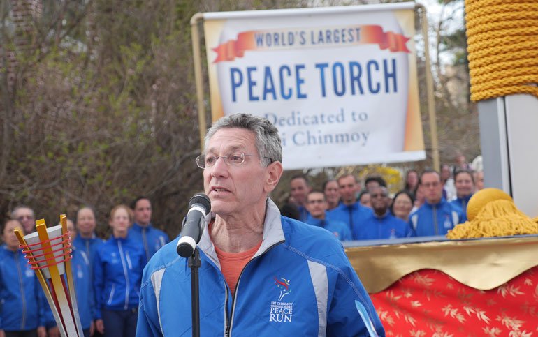 Ashrita speaking at World's largest Peace Torch