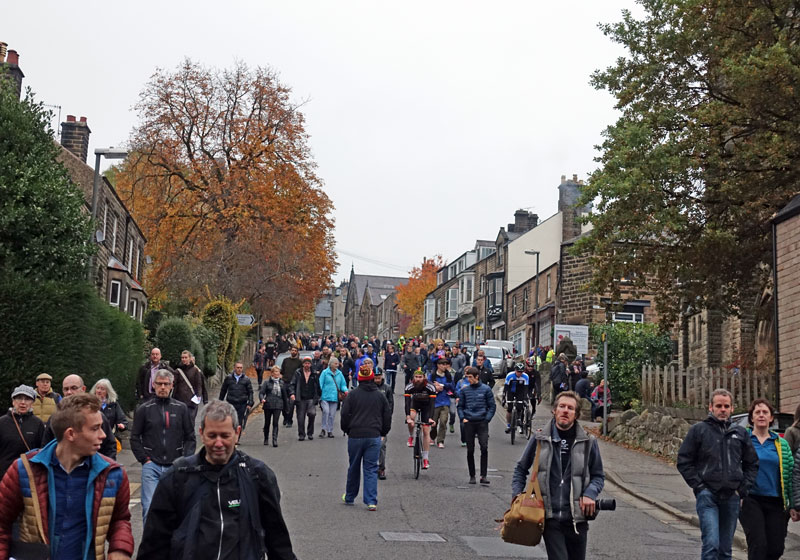 Spectators come down hill after race